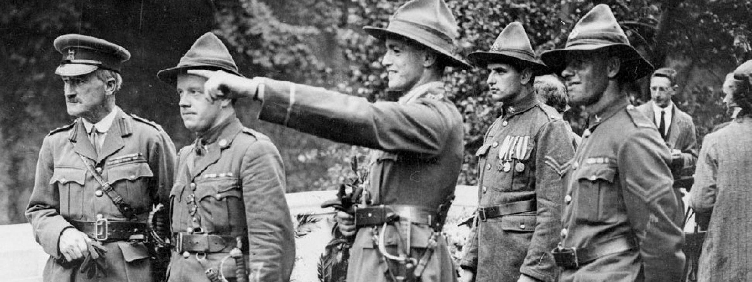 Leslie Averill (pointing) at the dedication ceremony for the New Zealand memorial at Le Quesnoy, France, 1923.